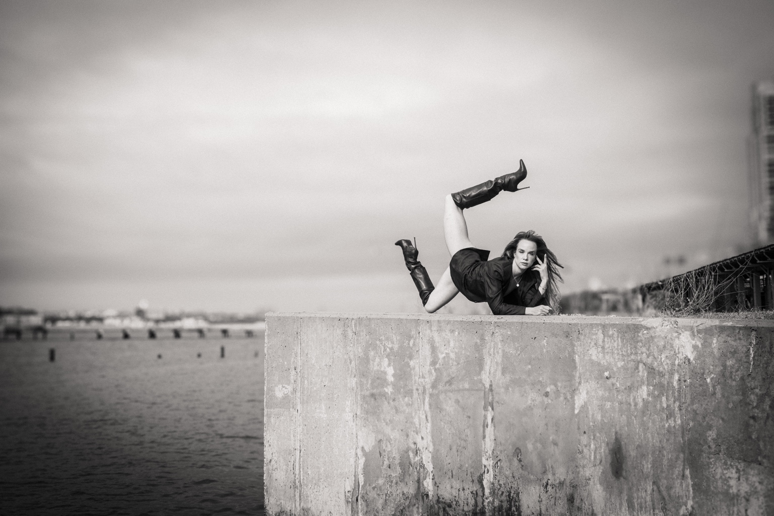Black and white portrait on concrete by the water